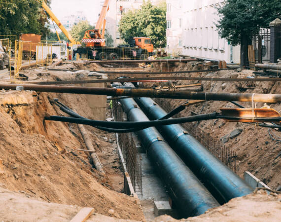 work area road repair, sewer repairs. tubes ground. maintenance area in city street. repair communications.
